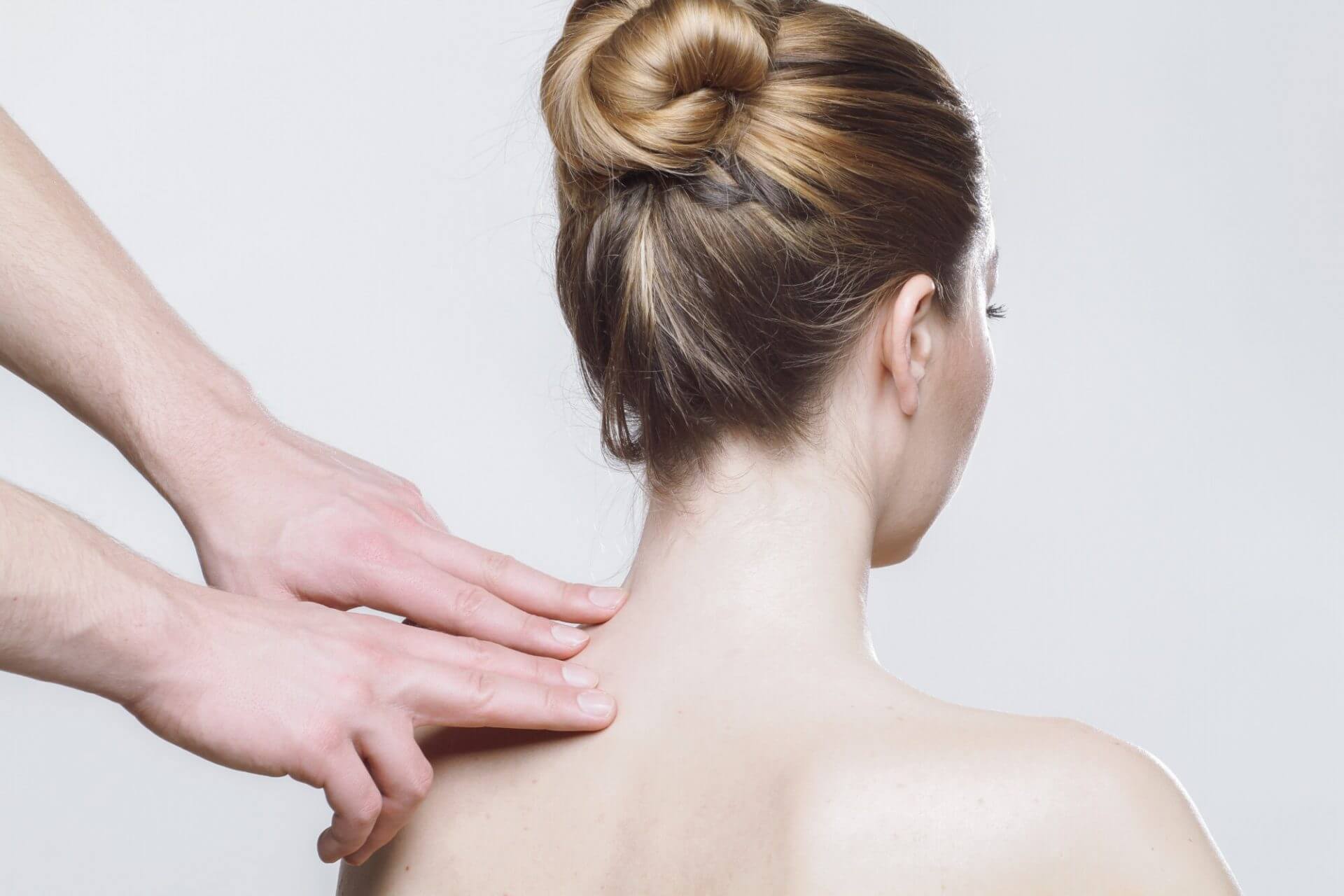 Shoulder And Neck Massage For Man In Spa Salon. Doctor Making Neck