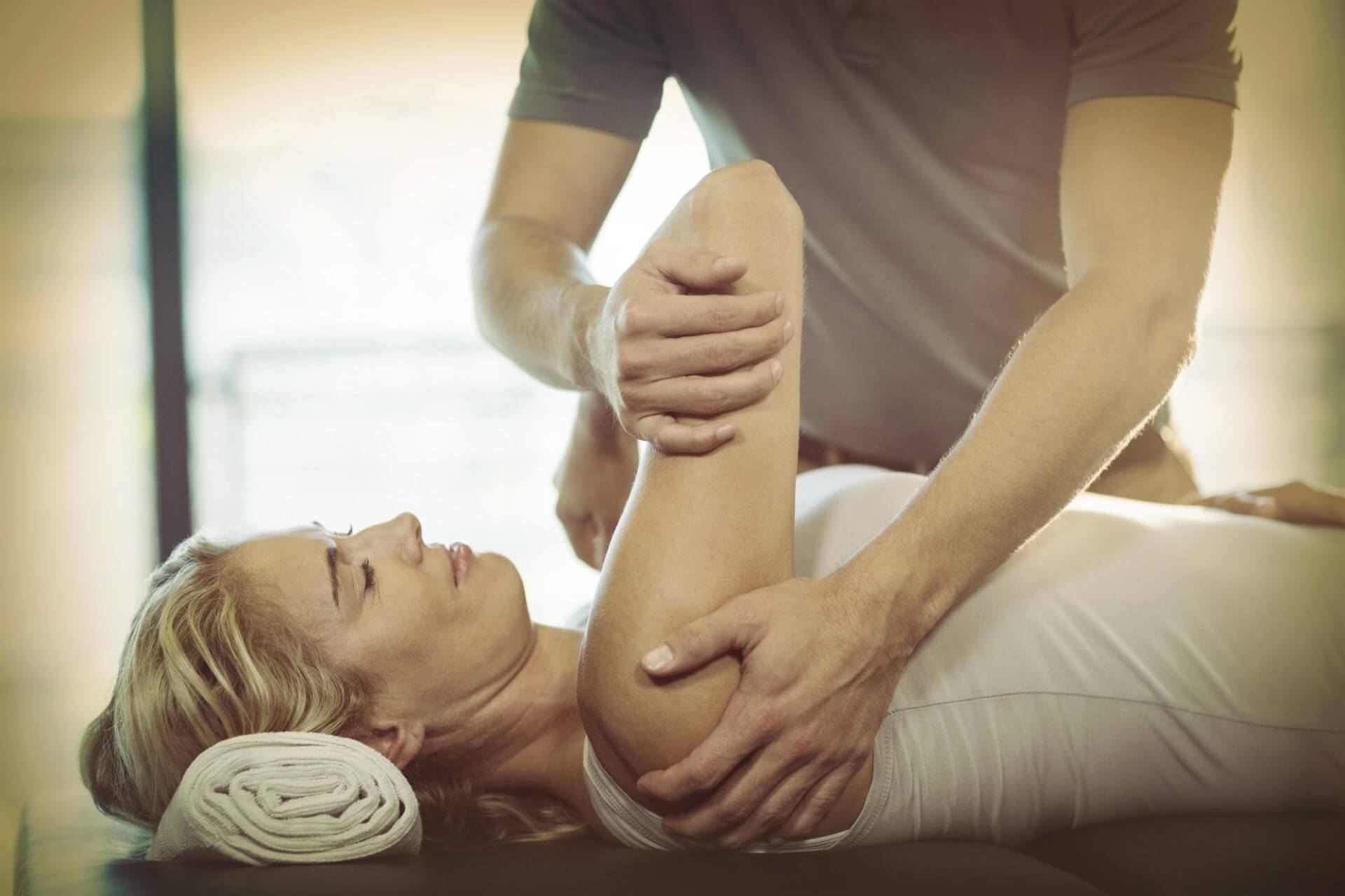 woman with massage therapist